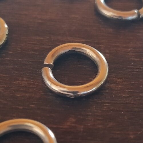 Paquete de 500 Argollas Plateadas para Accesorios